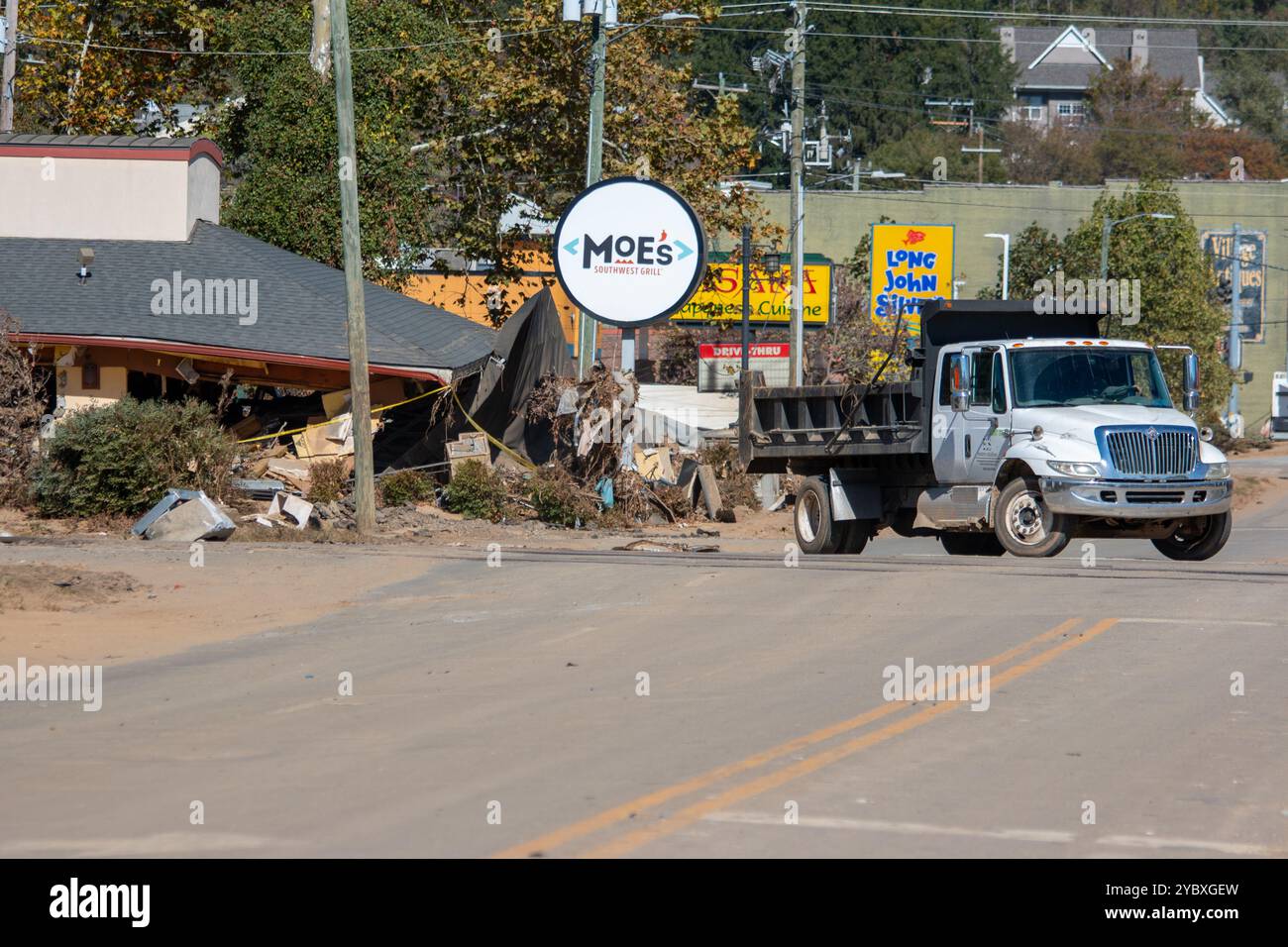 Biltmore Village, United States. 14 April, 2022. Workers begin removing debris from floods at the hard-hit downtown area of Biltmore Village in the aftermath of Hurricane Helene, October 17, 2024 in Asheville, North Carolina.  Credit: Dylan Burnell/USACE Photo/Alamy Live News Stock Photo