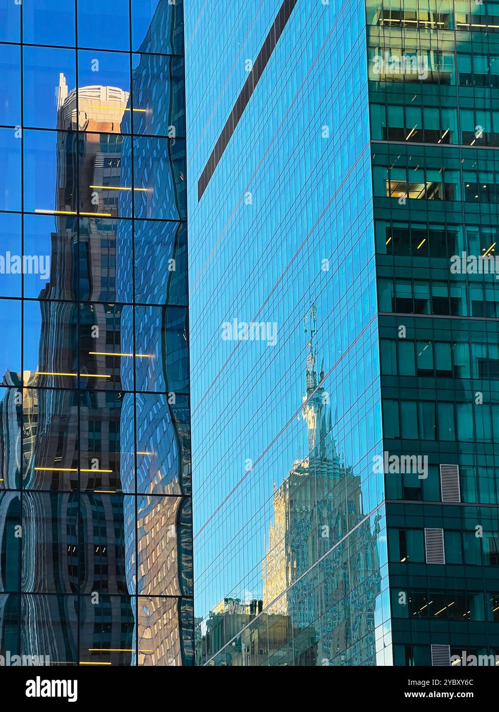 reflection of Empire State Building in windows of office block in mid town New York City, USA - Smartphone Captured Stock Image