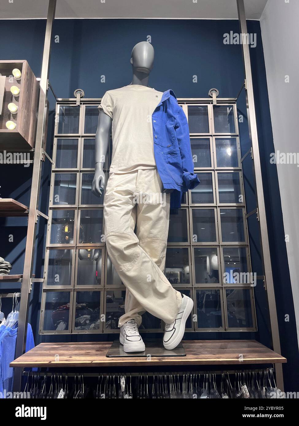 Blue shopping outlet centre interior with male mannequin dummy in retail store - Smartphone Captured Stock Image