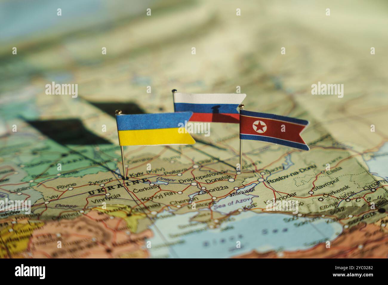 Ukraine, Kyiv - 2024 October 19: Ukraine, North Korea and Russia flags on Ukraine geopolitical map. North Korea fights on Ukraine lands Stock Photo