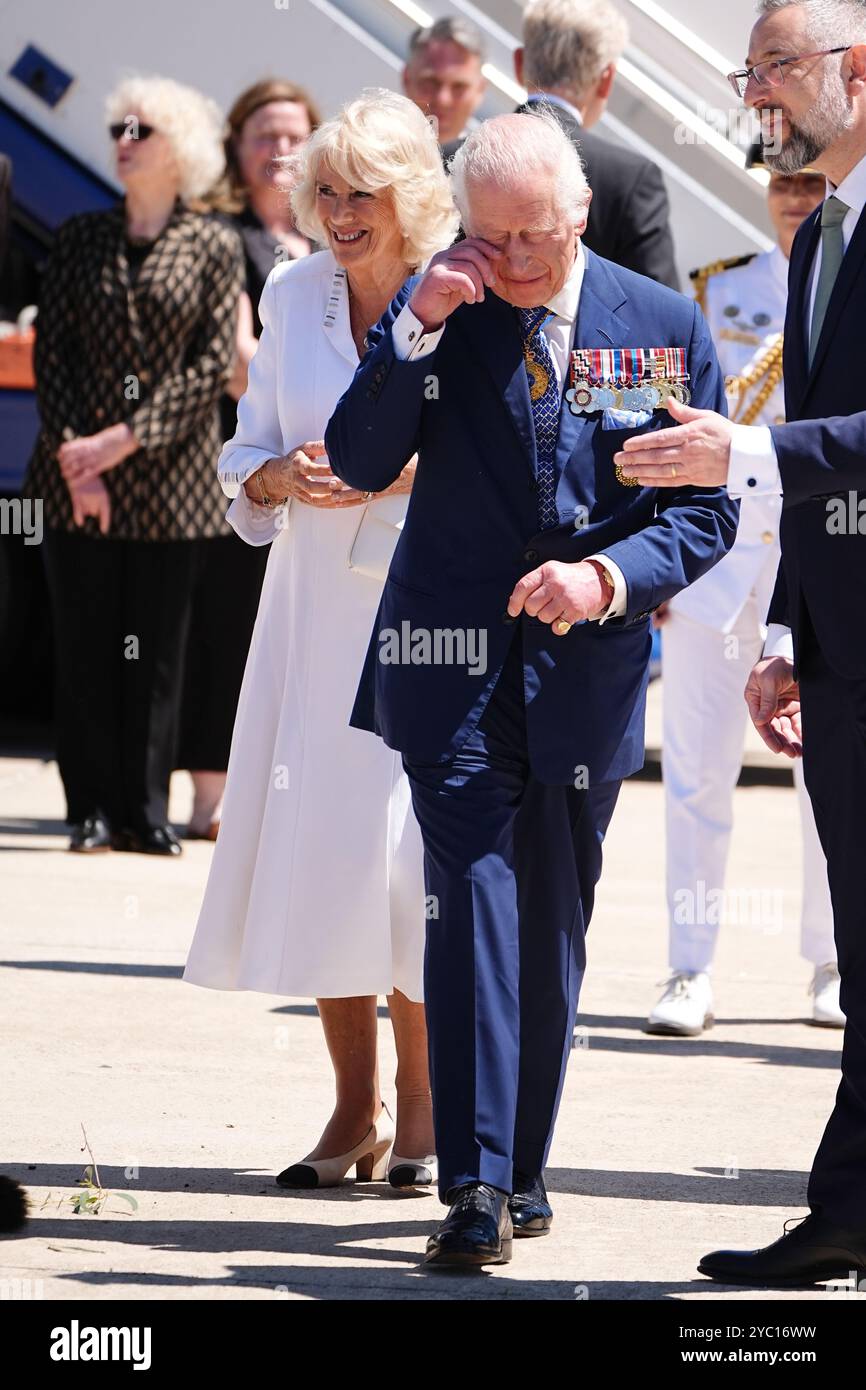King Charles III and Queen Camilla are welcomed by an official ...