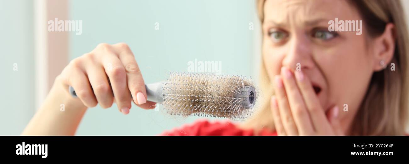 Hand holds hairbrush hi-res stock photography and images - Alamy
