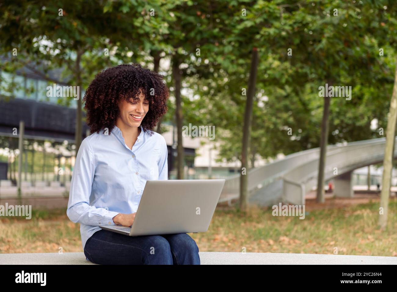 female entrepreneur working remotely on laptop Stock Photo