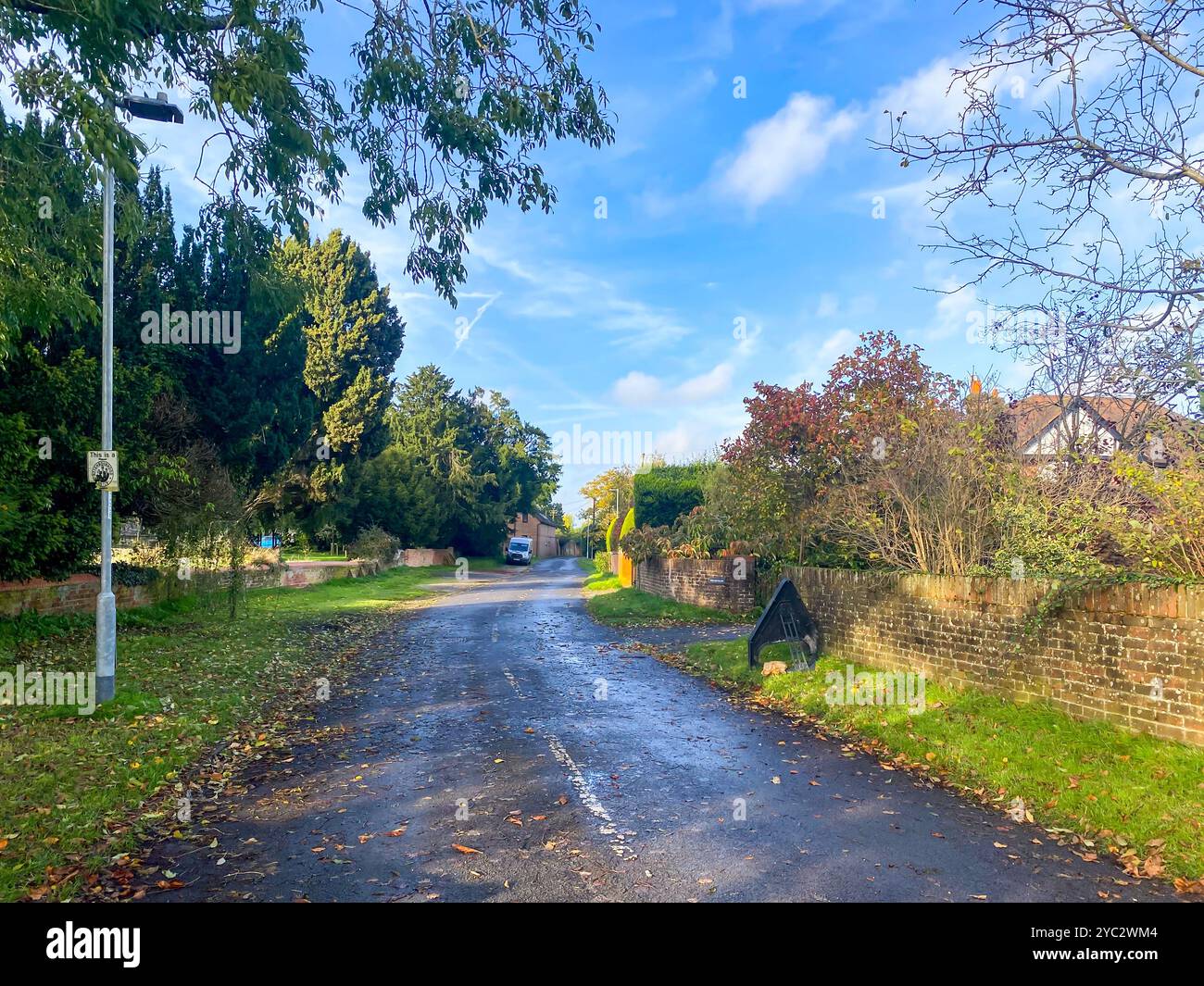 A view down Routh Lane, a residential street in Tilehurst in the suburbs of Reading, Berkshire, UK - Smartphone Captured Stock Image