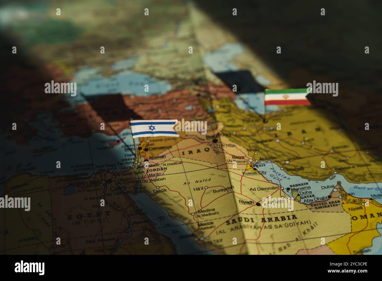 Israel and Iran flags on Middle east political map. Crisis and war between Israeli and Iran islamic republics. High quality photo Stock Photo