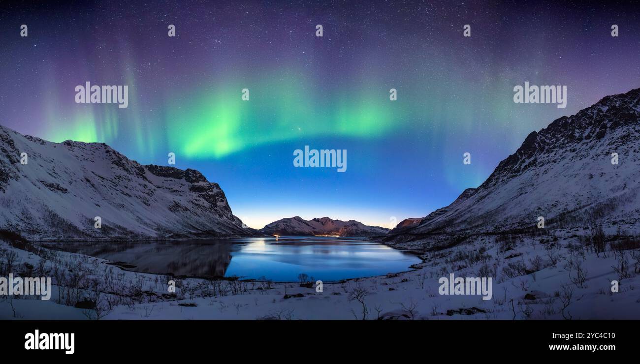 Tromso Norway aurora borealis northern lights panorama winter landscape at Grotfjord Stock Photo