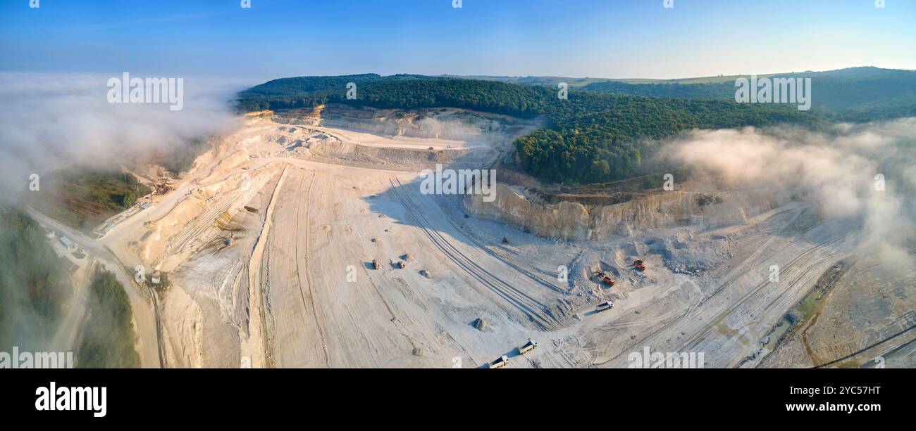 Aerial view of open pit mining site of limestone materials extraction ...