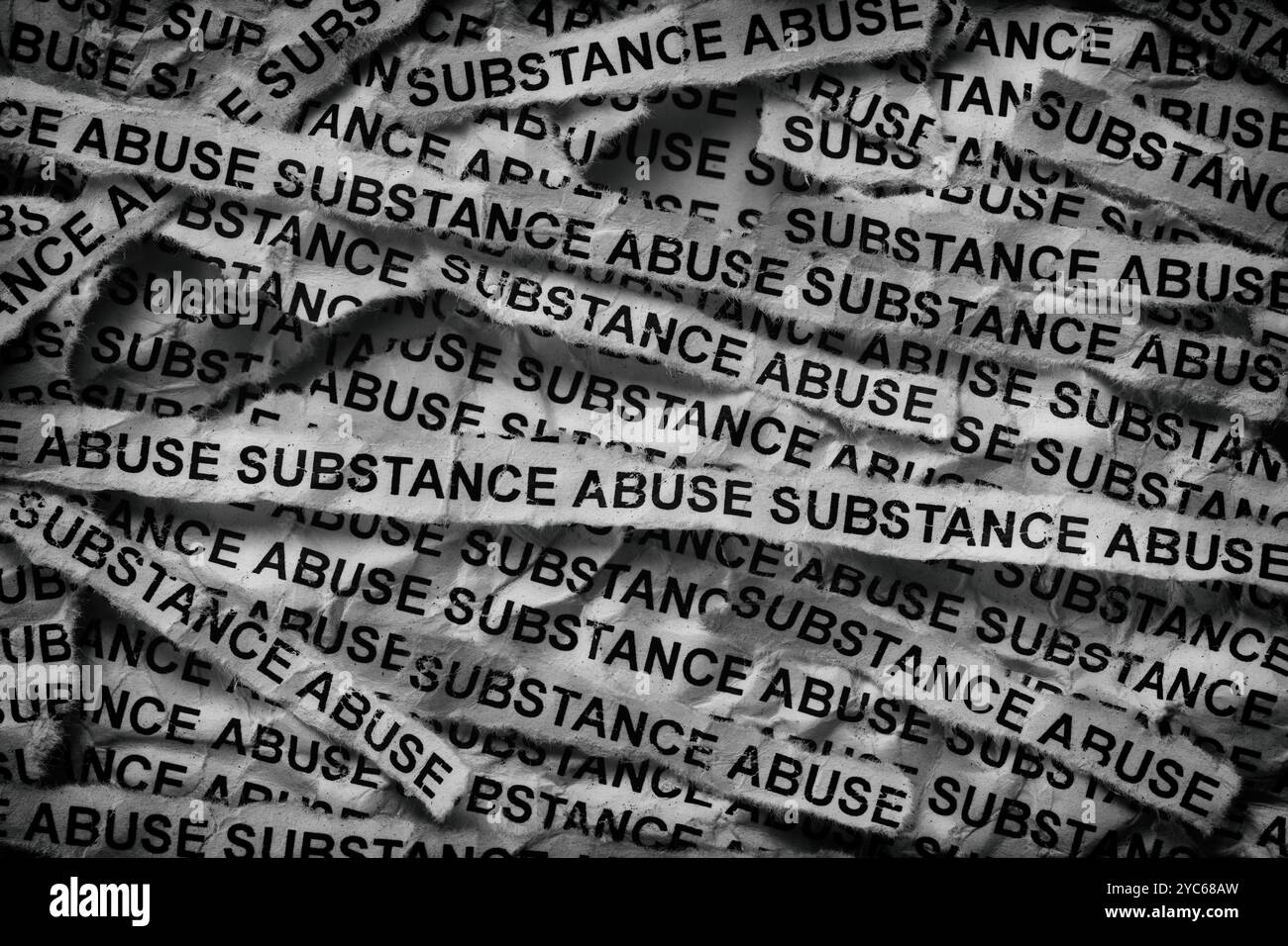 Strips of newspaper with the words Substance Abuse typed on them. Black and white. Close up. Stock Photo