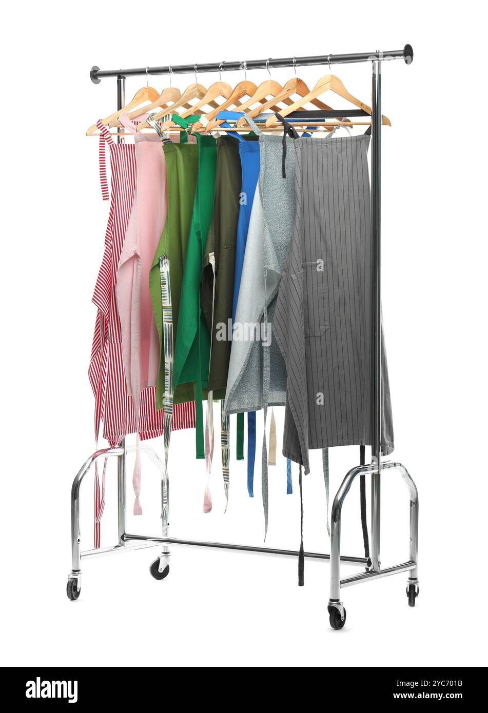 Chef's aprons on clothing rack isolated on white Stock Photo - Alamy