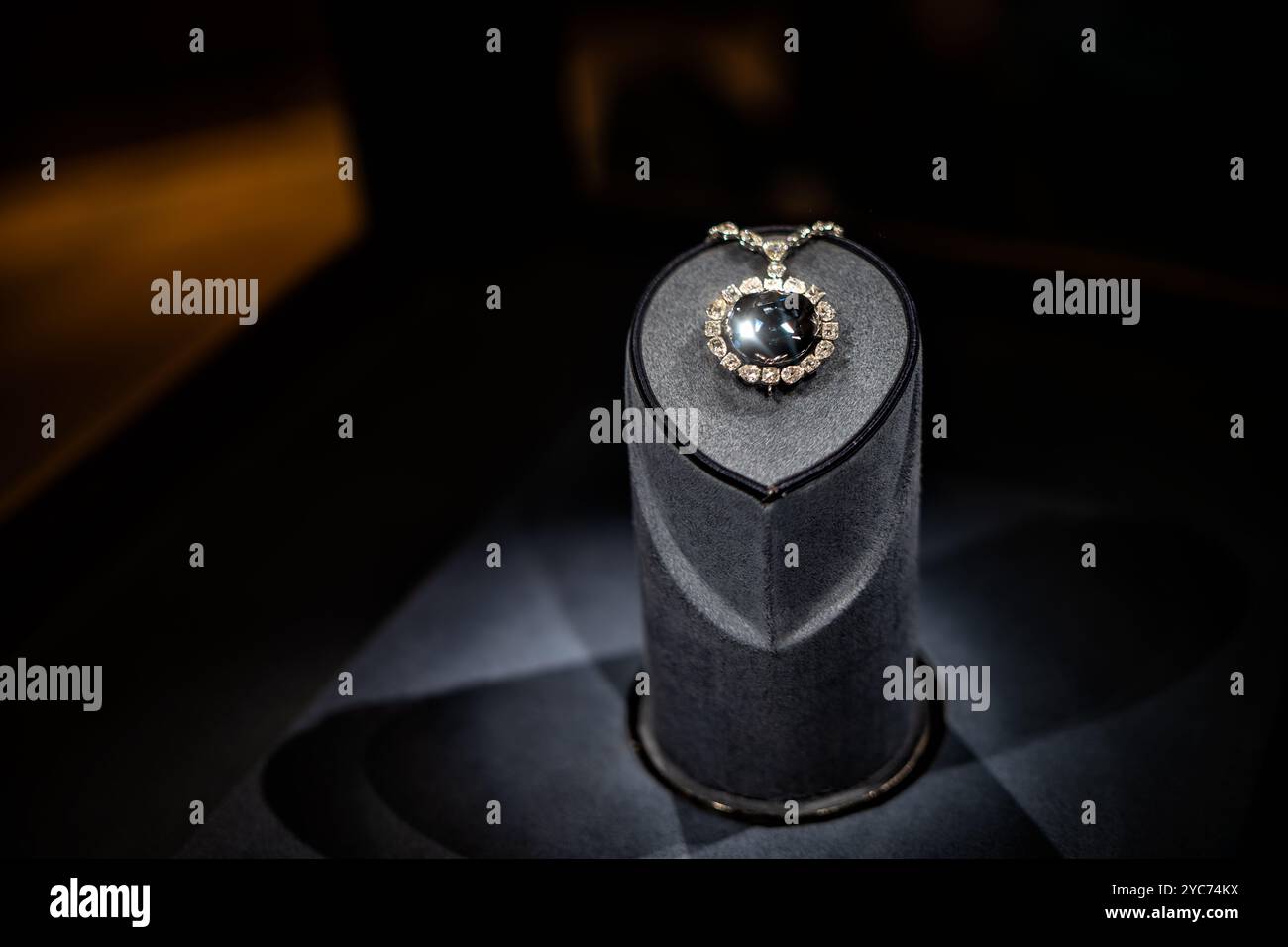 Hope Diamond Smithsonian National Museum Of Natural History Washington DC // WASHINGTON DC — The Hope Diamond, a rare 45.52-carat blue diamond, is one of the most famous gemstones in the world. It is on permanent display at the Smithsonian National Museum of Natural History in Washington, DC. Donated by jeweler Harry Winston in 1958, this iconic gem has a storied history dating back centuries. Stock Photo