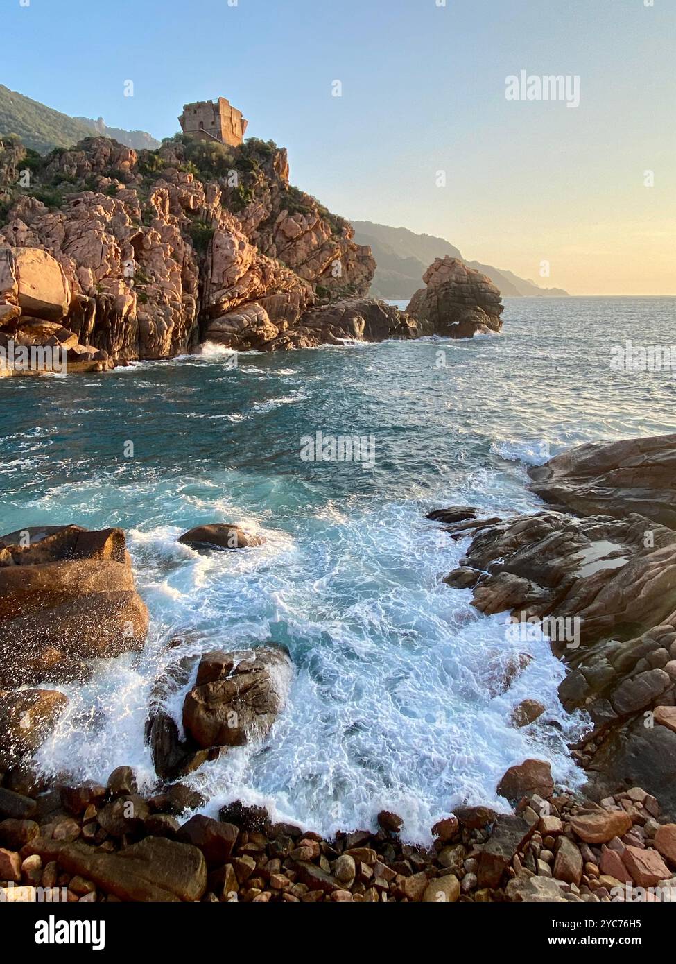 Majestic Coastal Cliffs With Waves Crashing at Sunset - Smartphone Captured Stock Image