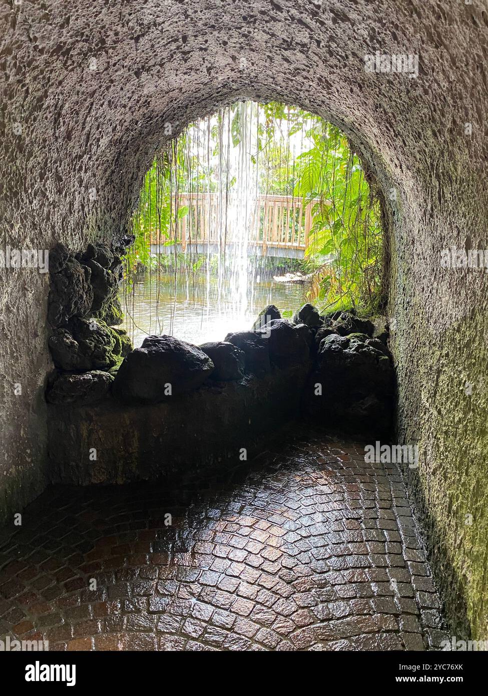 Enchanting Grotto View with Cascading Waterfall - Smartphone Captured Stock Image