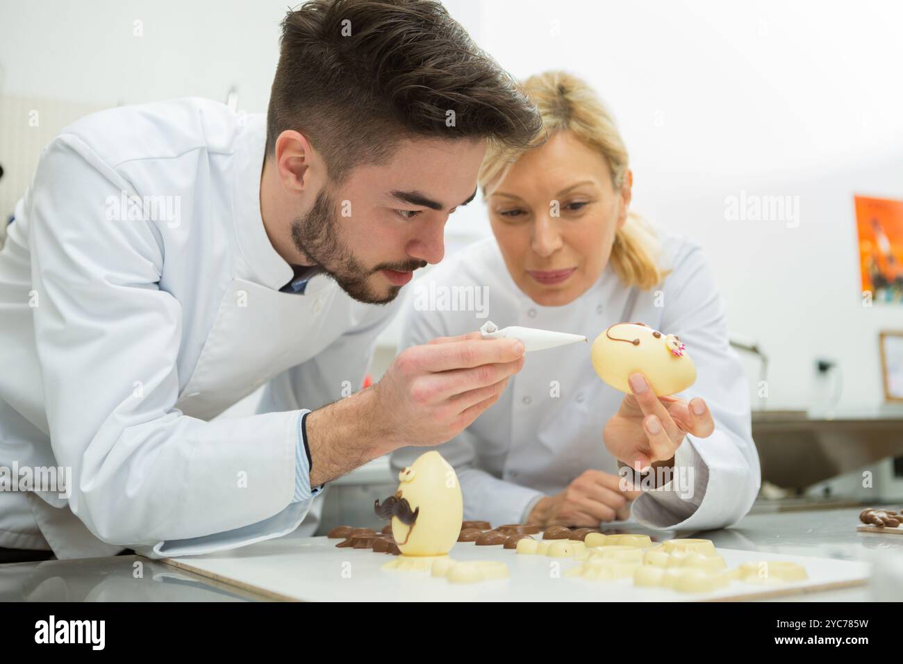 portrait of people working on easter eggs Stock Photo