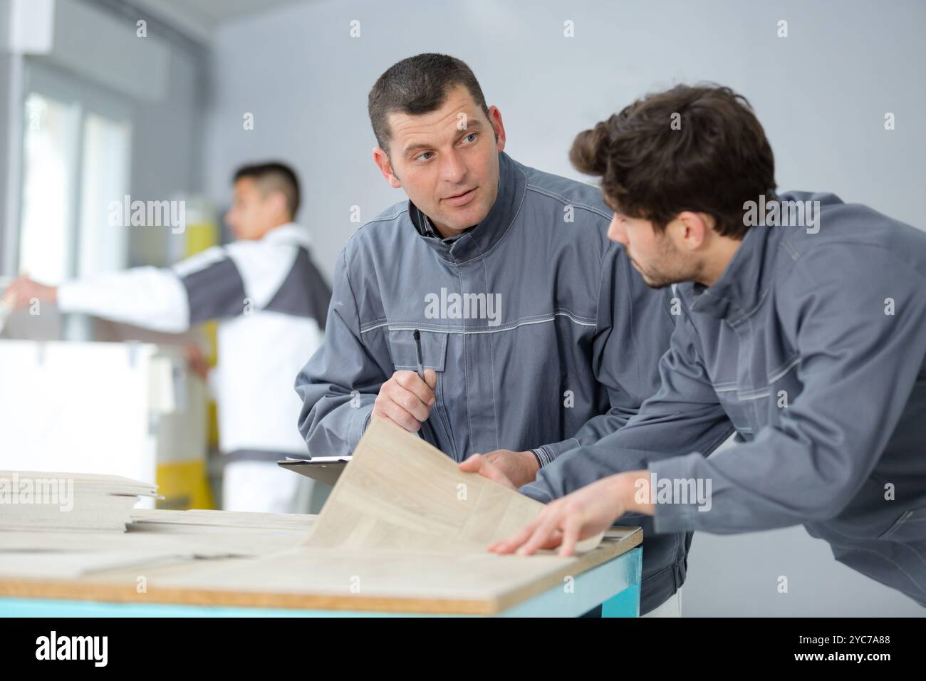 learning to stick flooring tile Stock Photo - Alamy