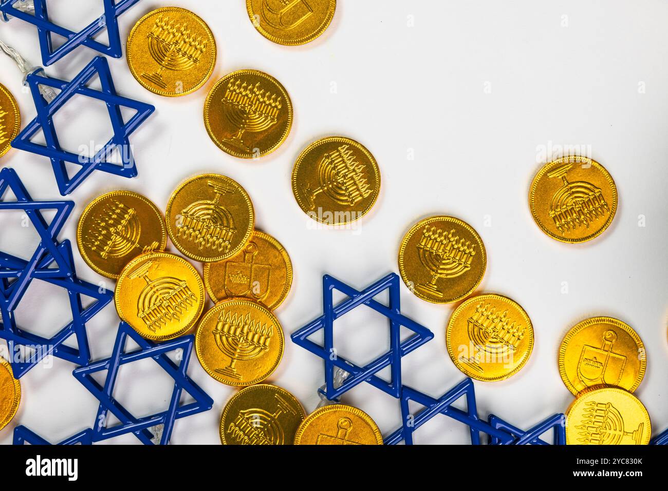 Gold Gelt and Blue Stars of David on White Background. Hanukkah ...