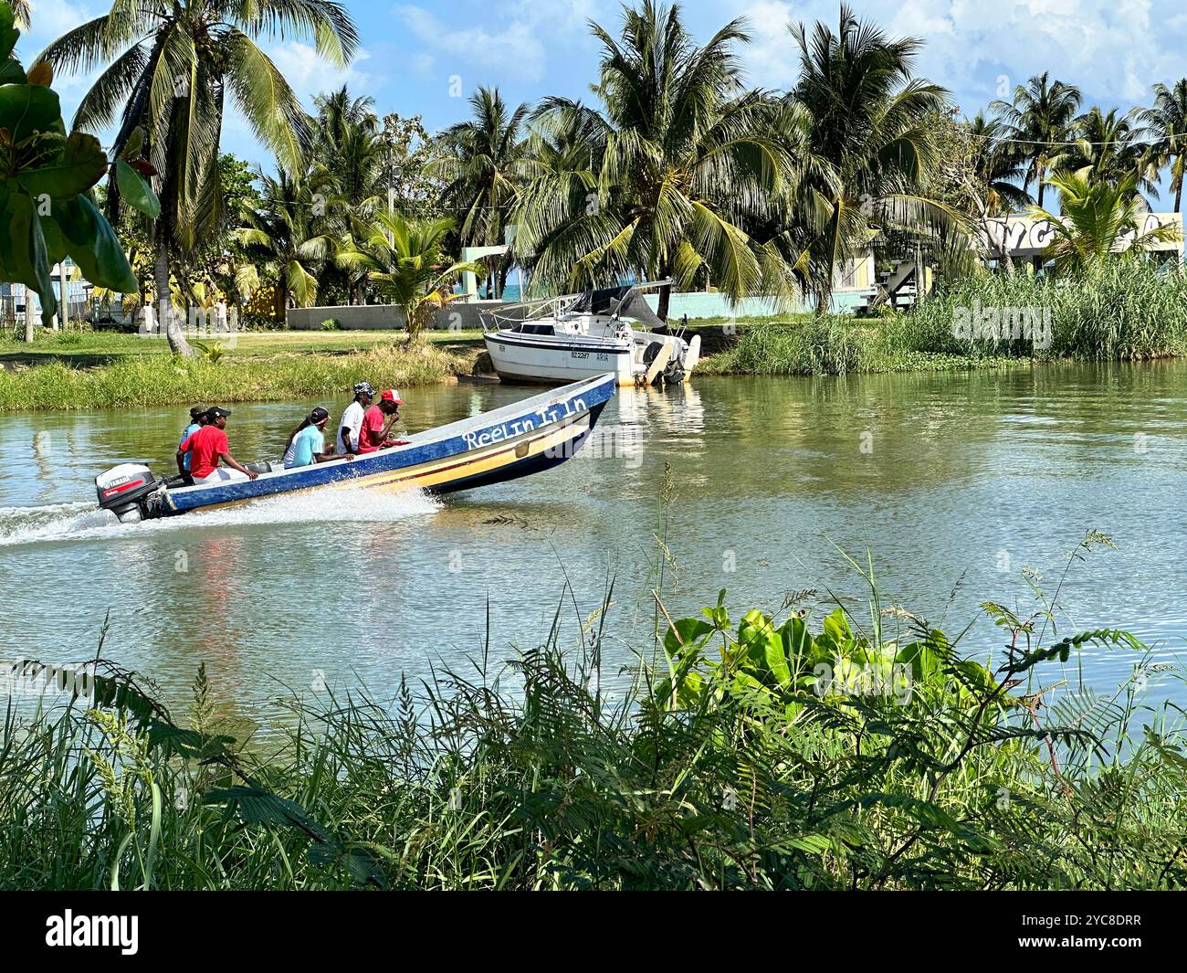 boat on the North Stann Creek River heading out to sea in Dangriga ...