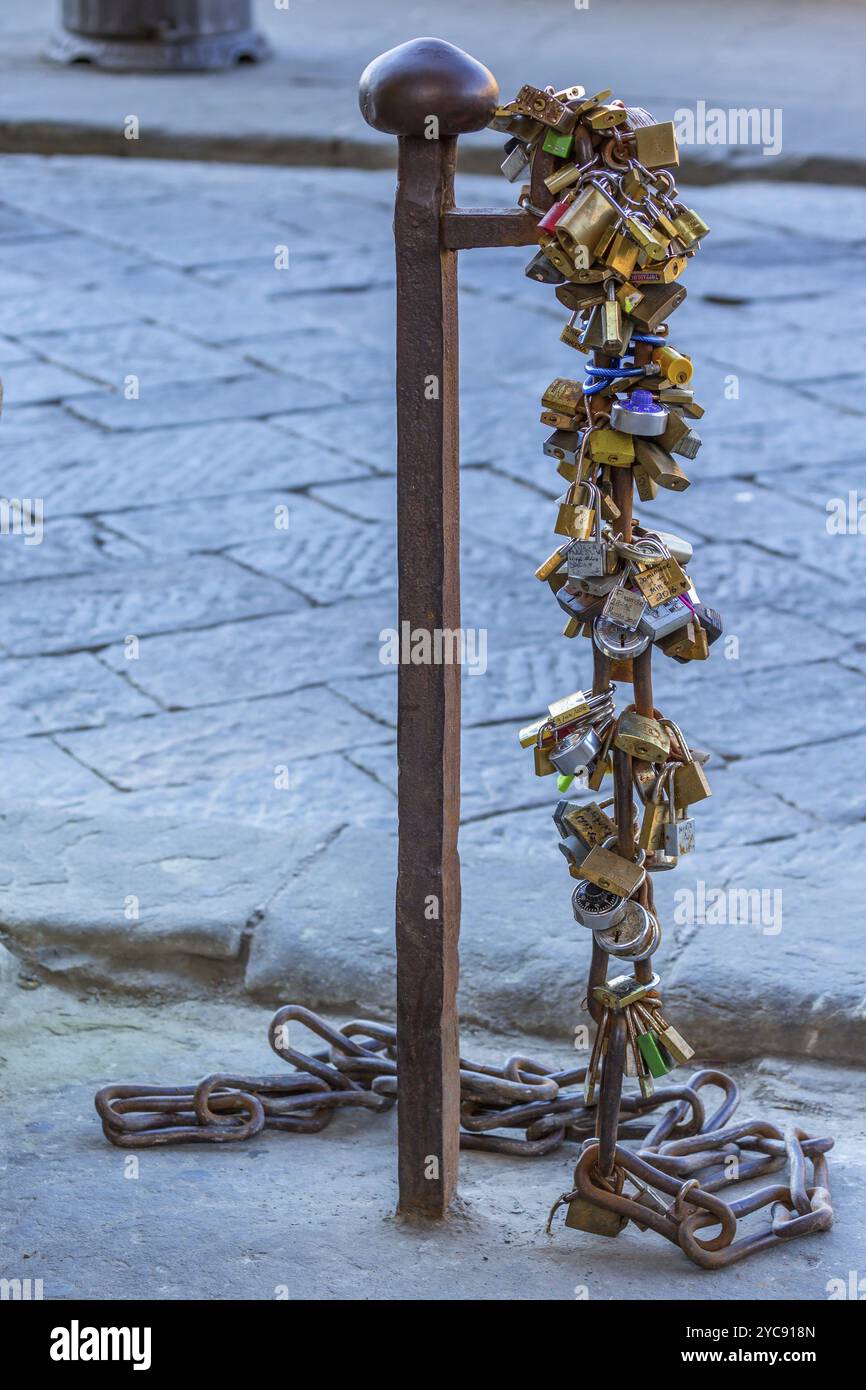 Padlocks on a pole in the street Stock Photo