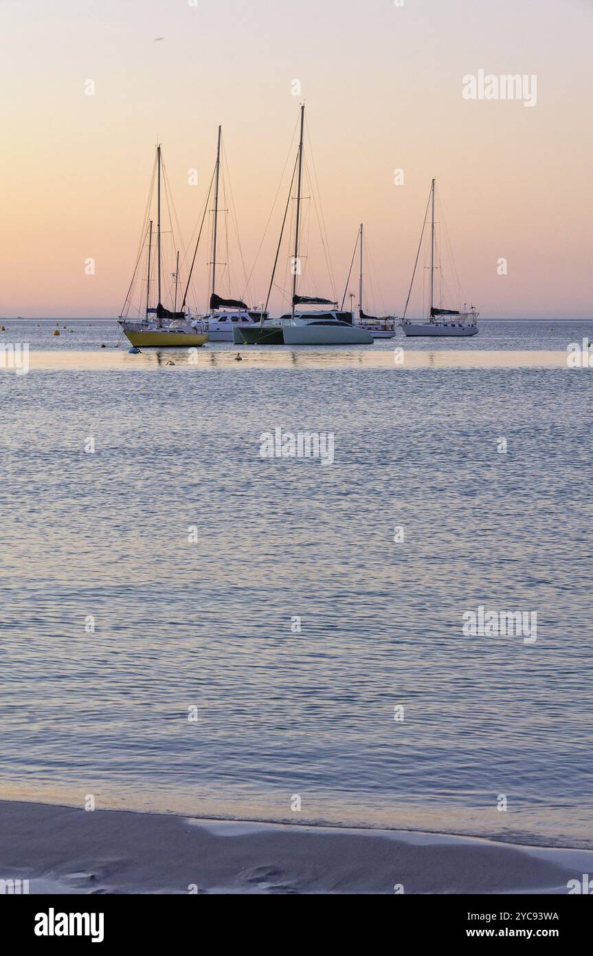 Yachts anchored in the bay at twilight, Dunsbrough, WA, Australia ...