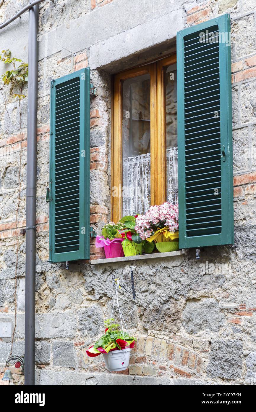 Residential house Window with flowers Stock Photo - Alamy