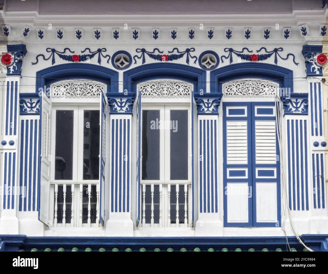Traditional white and blue facade of a shophouse in Little India ...
