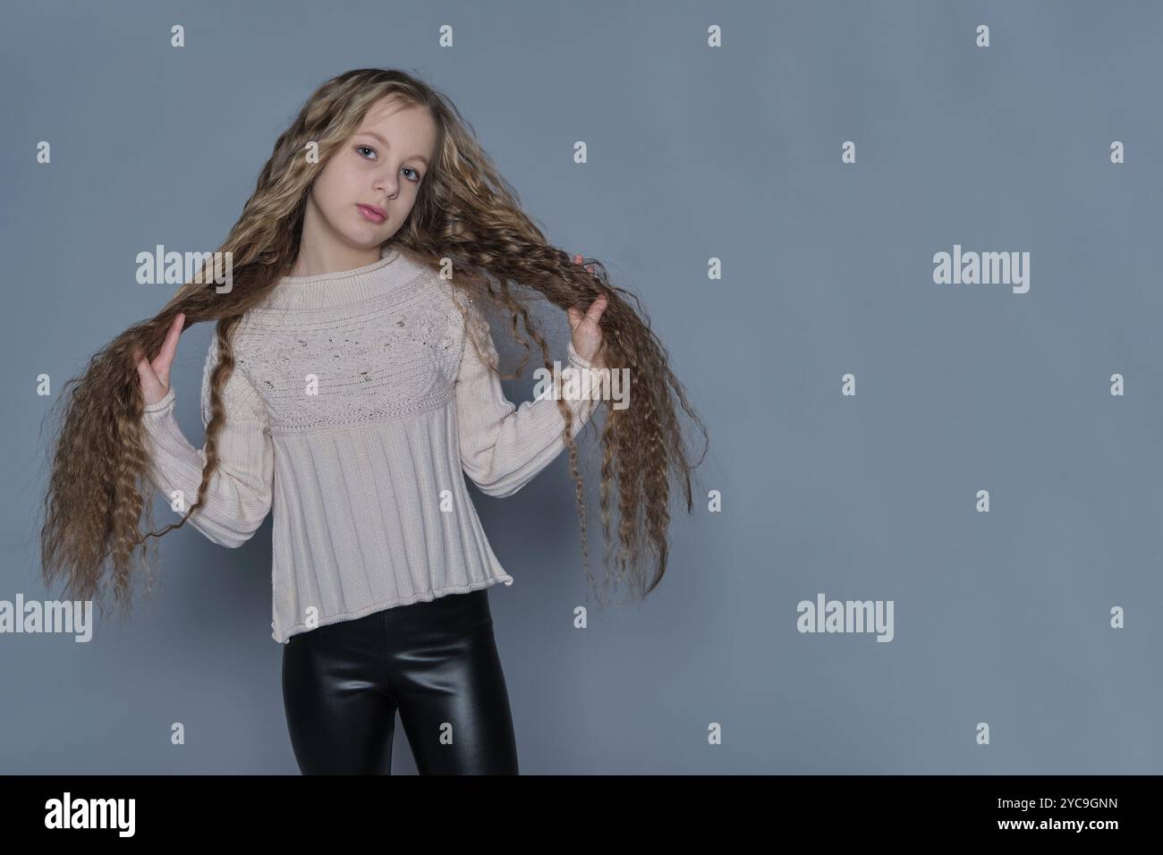 Girl long curly hair enjoys hi-res stock photography and images - Alamy