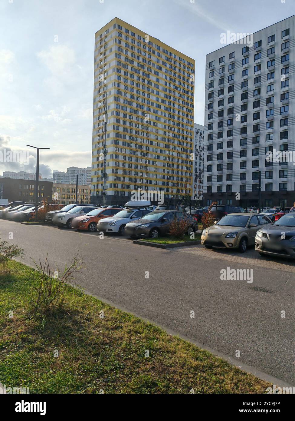 Visual Reference: Modern High Rise Residential Complex With Yellow And White Facades