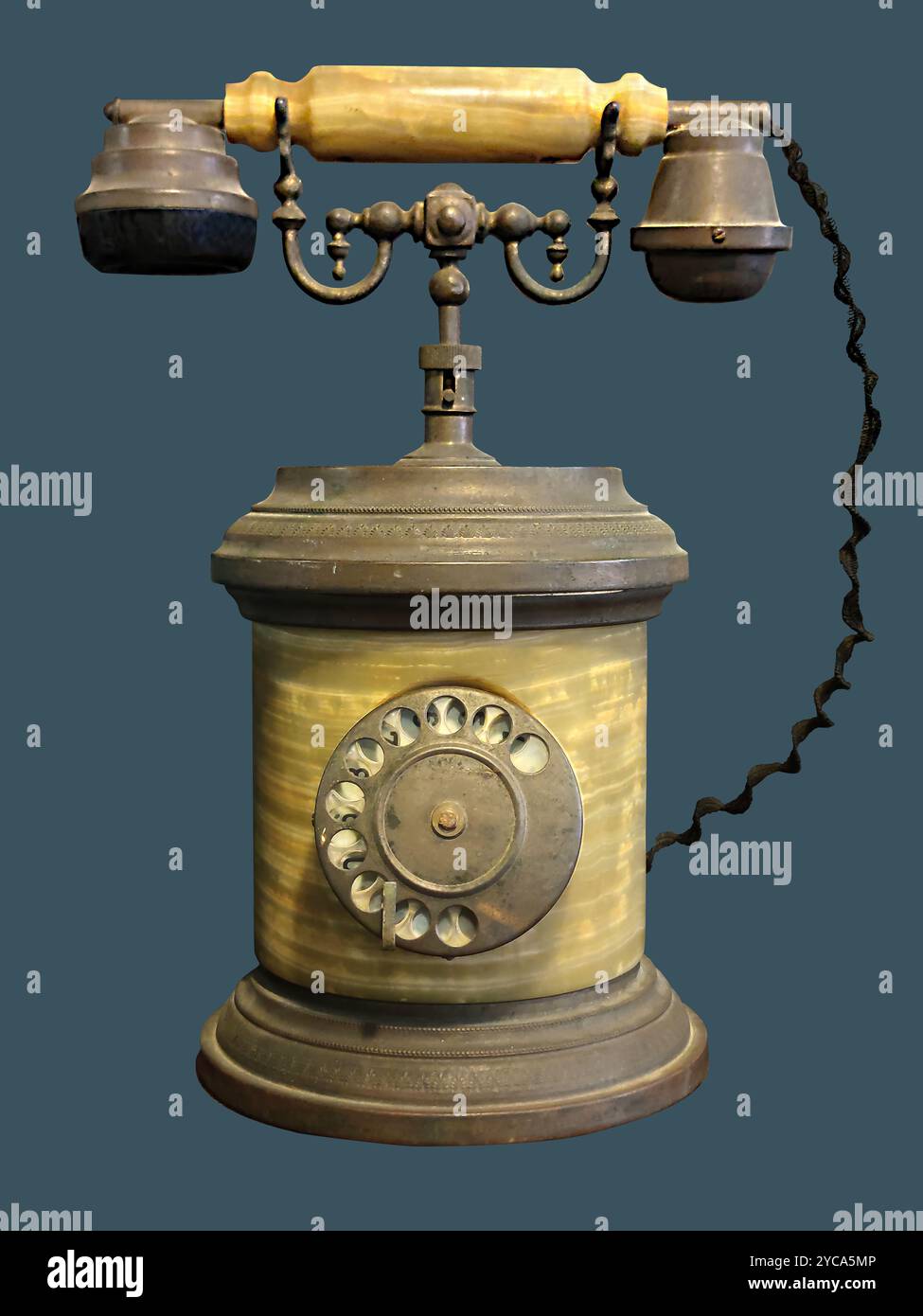 Antique rotary dial telephone on isolated blue background with clipping path. Stock Photo