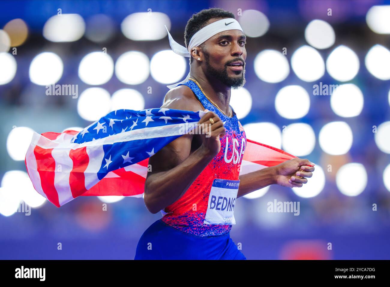 Bednarek celebrating with her country's flag in the 200 meters at the Paris 2024 Olympic