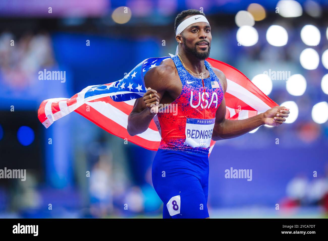 Bednarek celebrating with her country's flag in the 200 meters at the Paris 2024 Olympic
