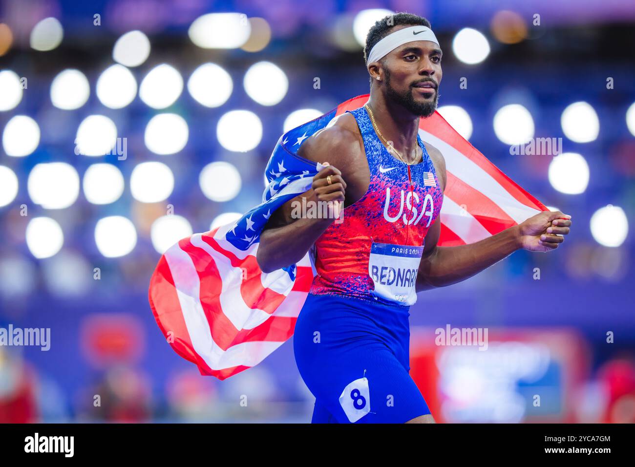 Bednarek celebrating with her country's flag in the 200 meters at the Paris 2024 Olympic