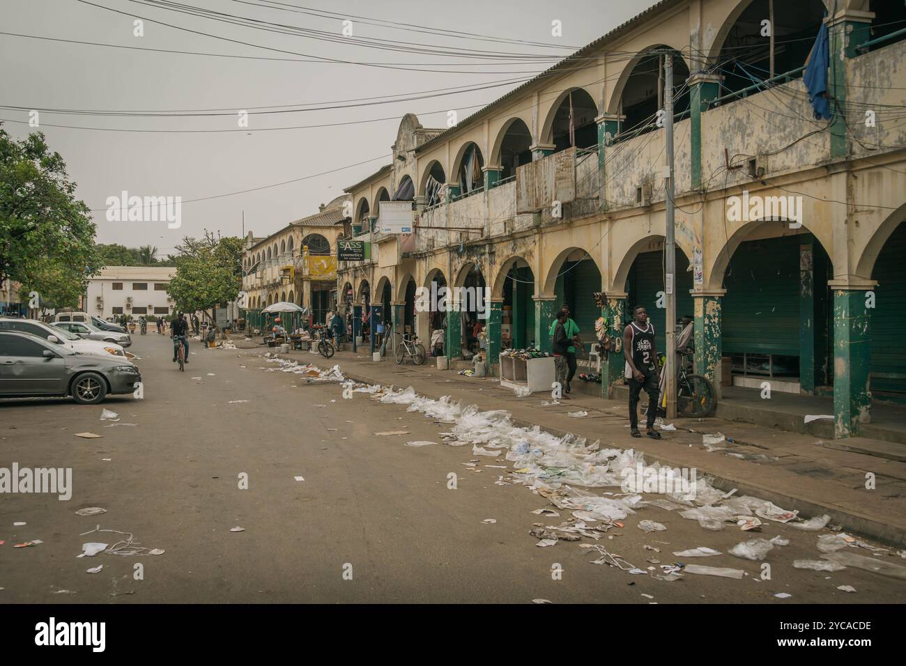 The trash on the streets of Banjul, nearby beautiful colonial building at Gambia capital. Stock Photo