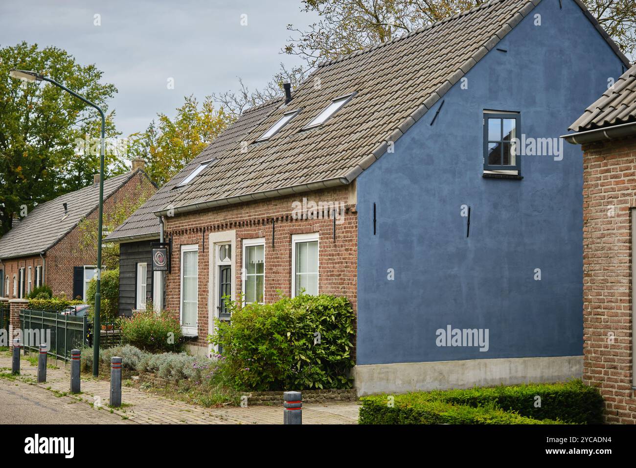 Typical renovated cottage's in Opwetten, a neighborhood of Nuenen, the Van Gogh village in Noord-Brabant, the Netherlands with a bed & breakfast. Stock Photo