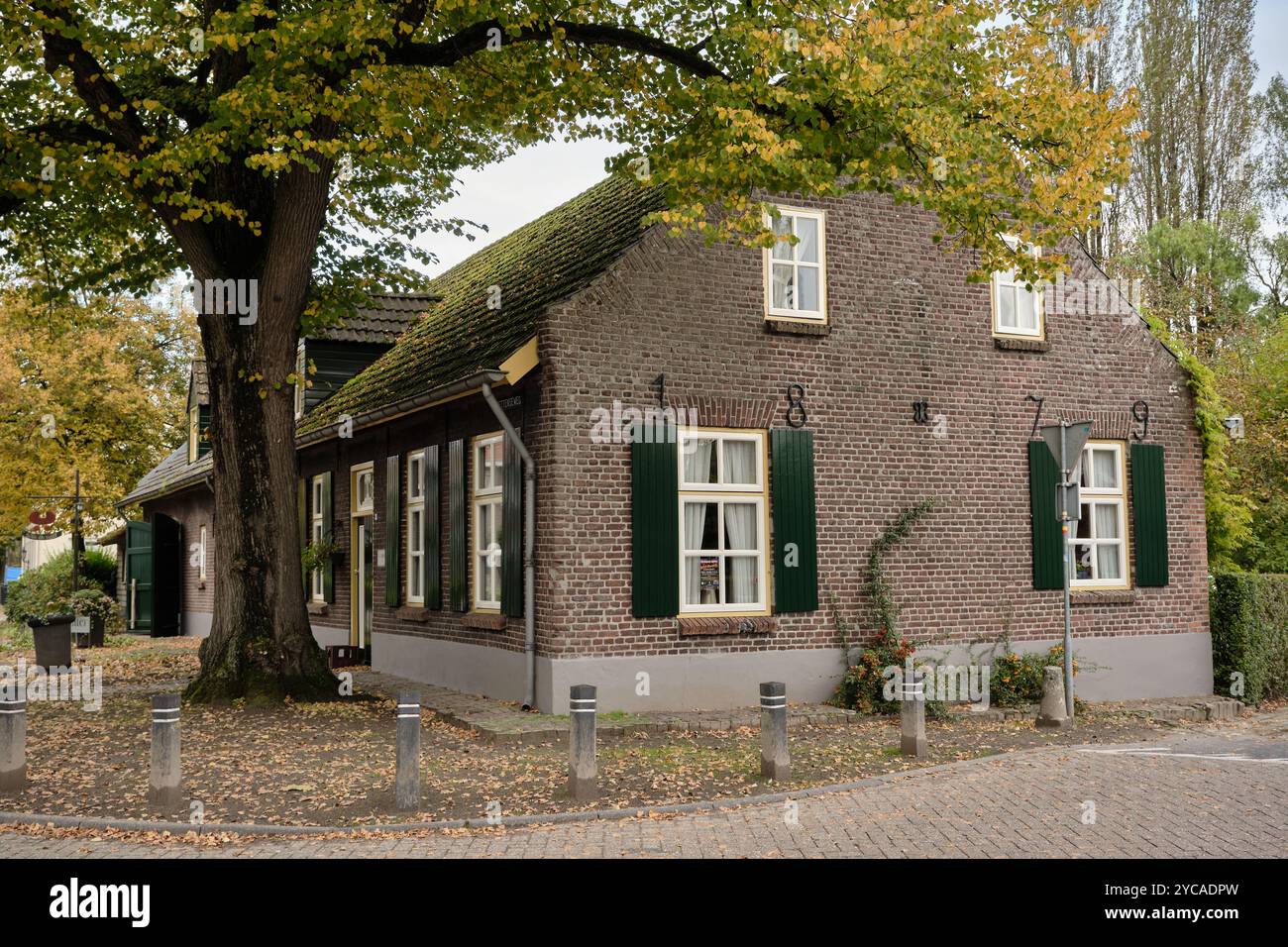 Typical former farmhouse from 1879, in Opwetten, a neighborhood of Nuenen, the Van Gogh village in Noord-Brabant, the Netherlands. Stock Photo