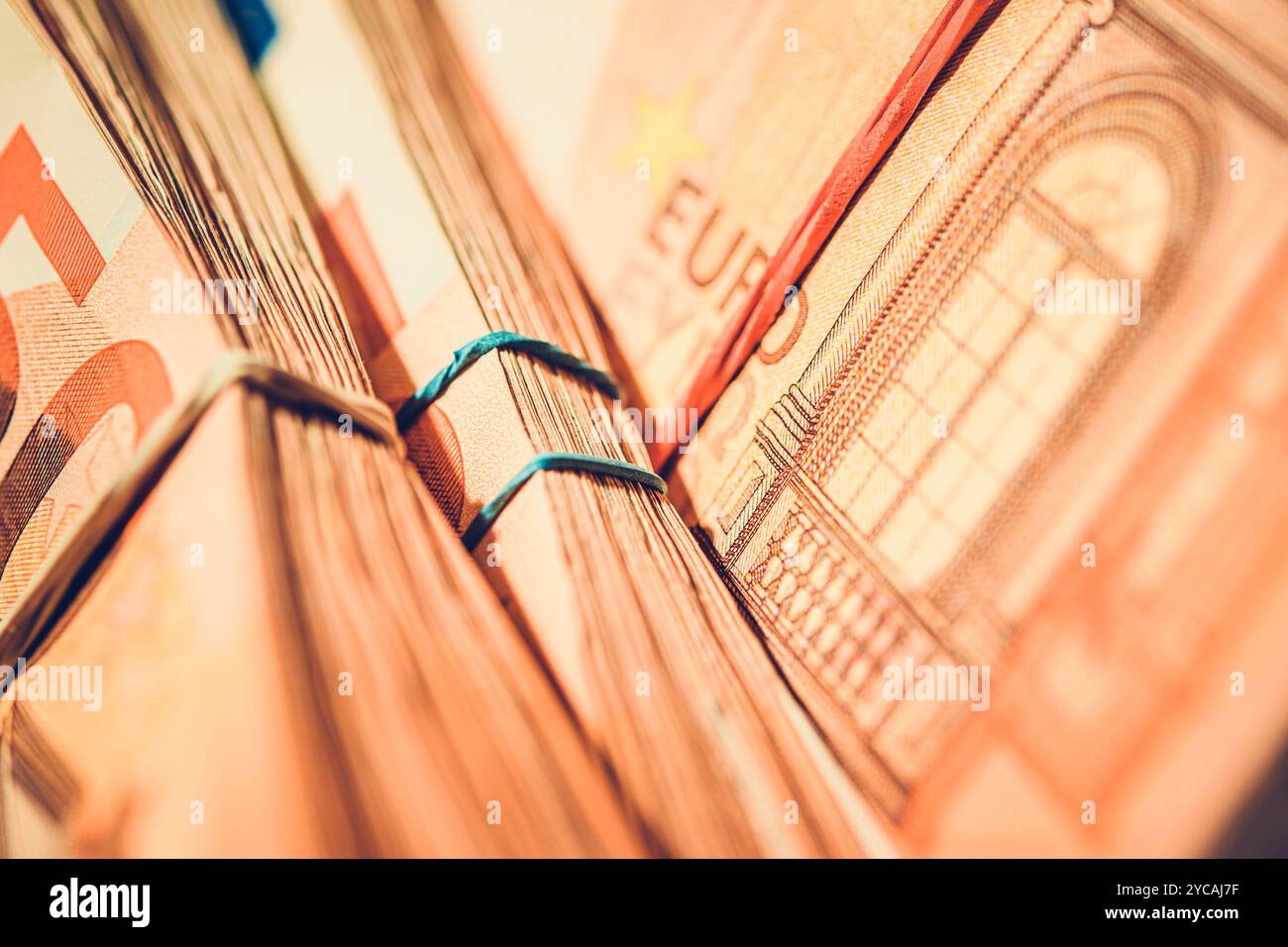 A collection of neatly wrapped euro banknotes is displayed, highlighting the intricate details and various denominations, emphasizing currency and val Stock Photo