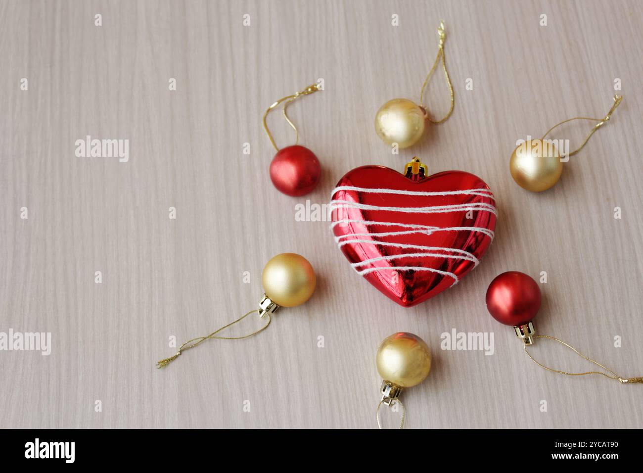 Red and golden Christmas ornaments for winter season holiday celebration. Also suitable for artificial insemination concept. Copy space available. Stock Photo