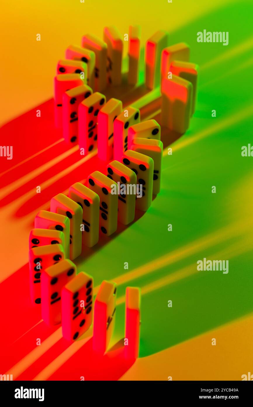 Red yellow dominoes falling in hi-res stock photography and images - Alamy