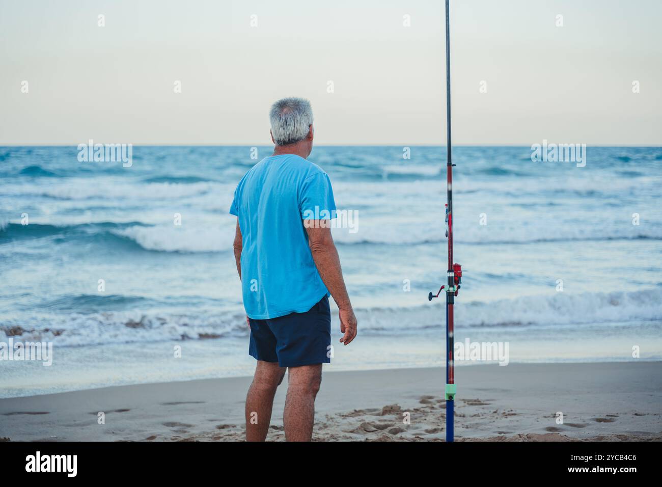 Mature man stands contemplatively in hi-res stock photography and ...