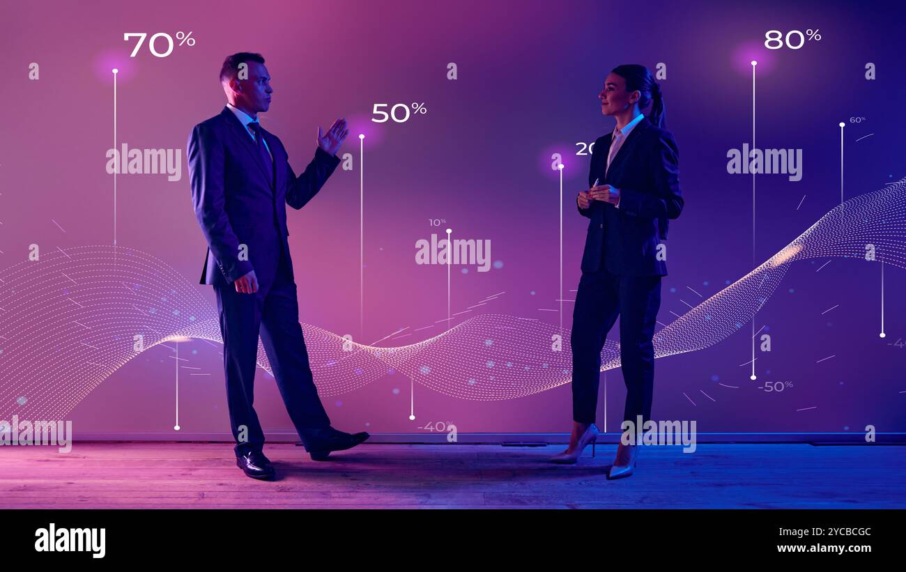 Female and male business professional breaks down data patterns ...