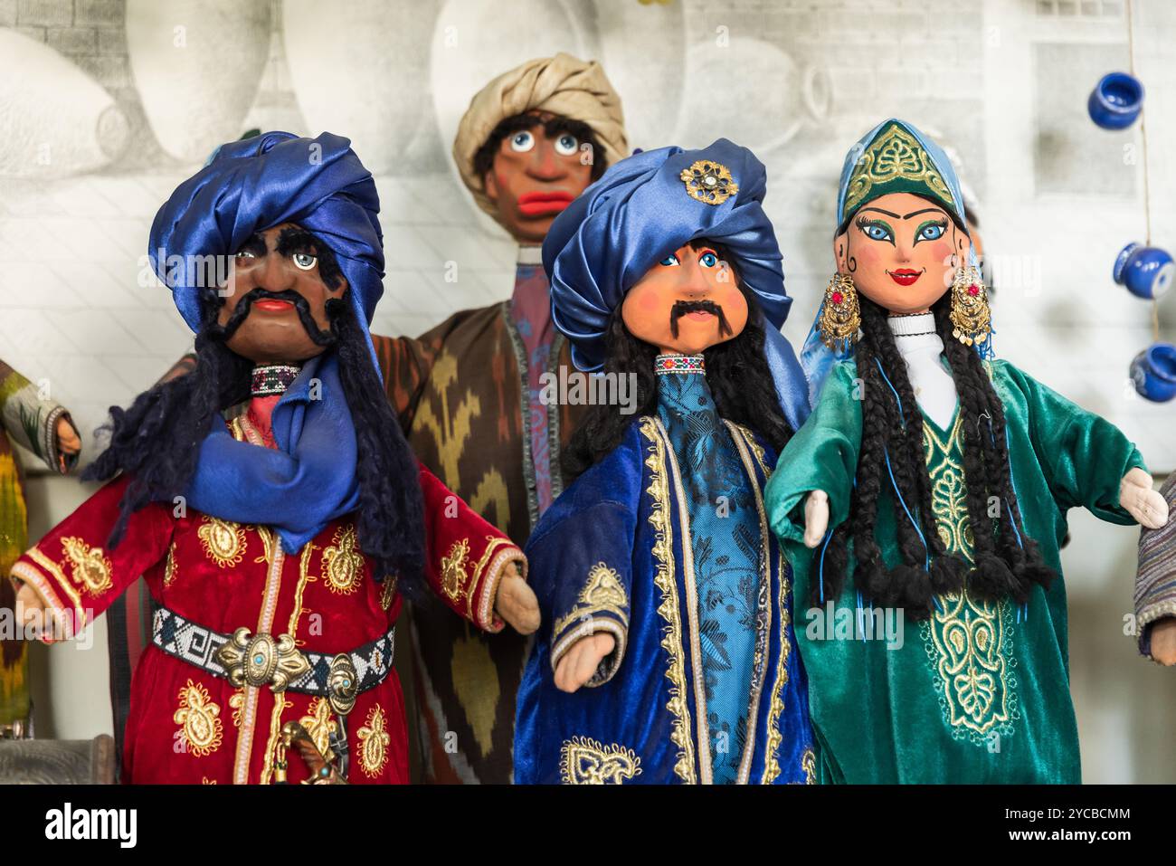 Handmade Uzbek hand puppets for sale are on the counter desk of tourist shop in old town of Bukhara, Uzbekistan Stock Photo