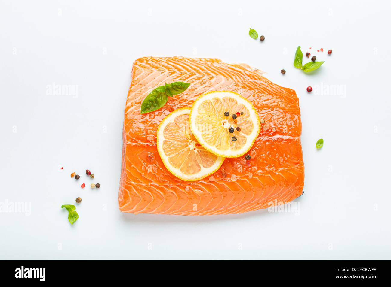 Fresh raw salmon marbled fillet isolated on white background with lemon ...