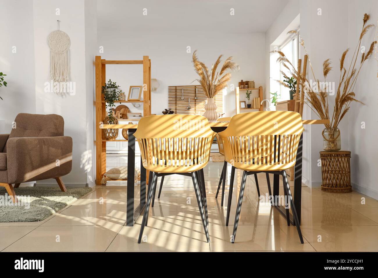Interior of modern studio apartment with dining table Stock Photo - Alamy