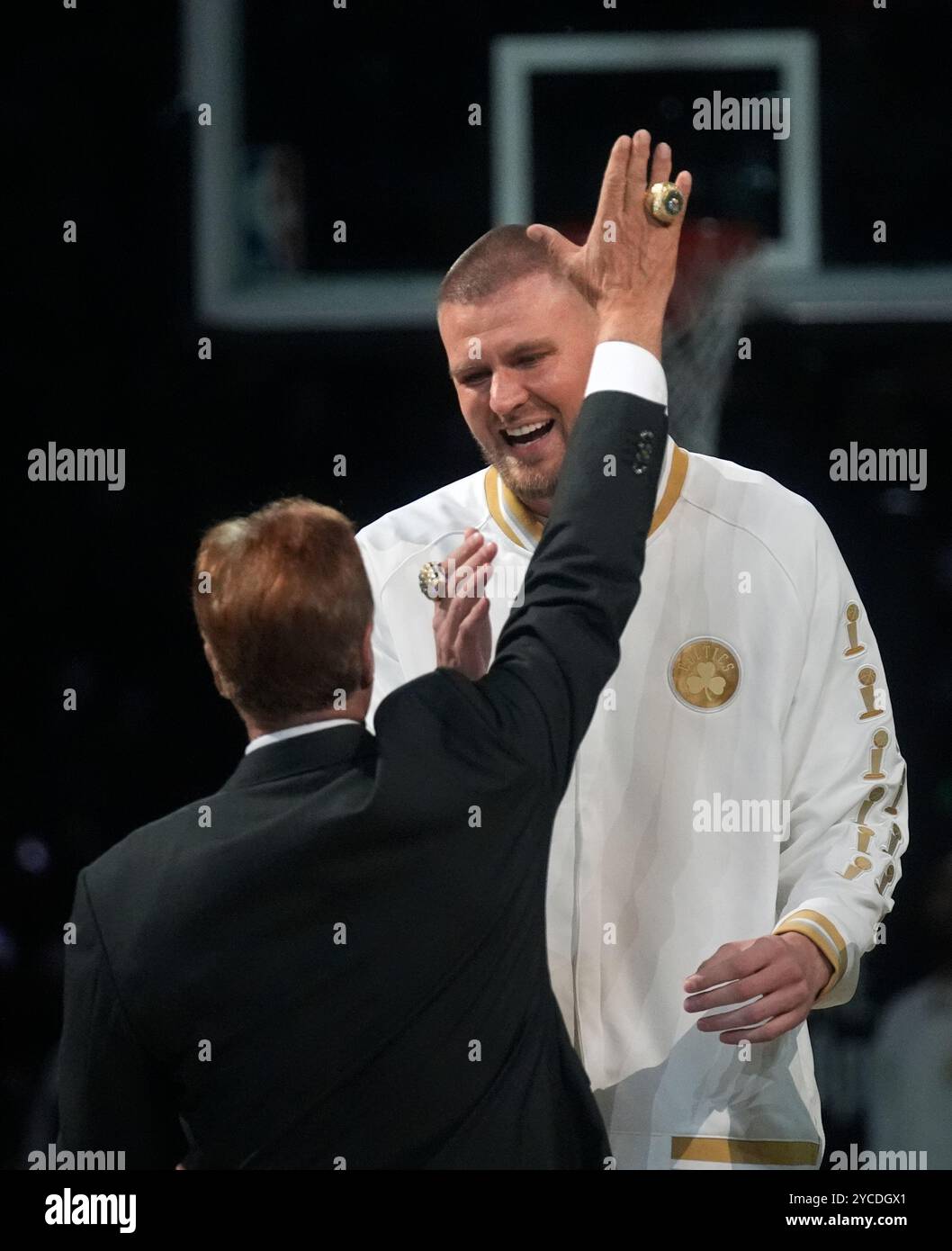 Boston Celtics center Kristaps Porzingis, celebrates with team owner