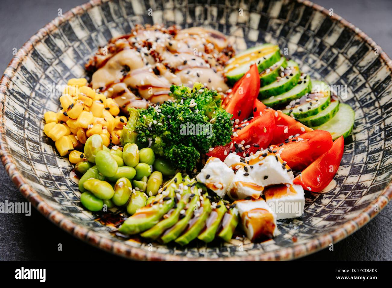 Colorful Buddha bowl with fresh vegetables, quinoa, and avocado ...