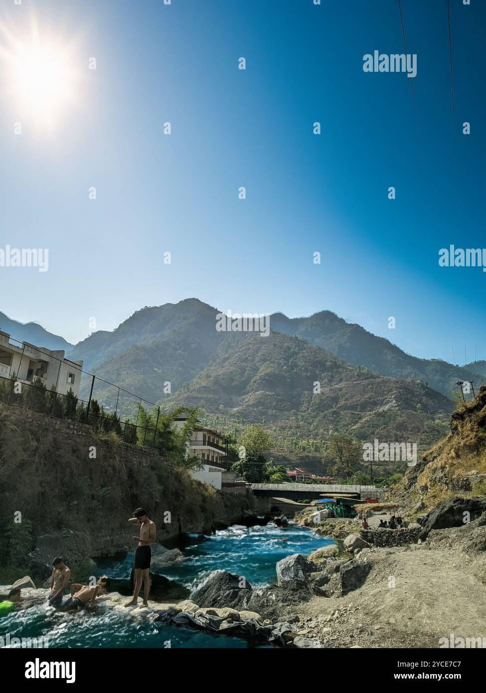 Mountains with a beautiful river where people are enjoying - Smartphone Captured Stock Image