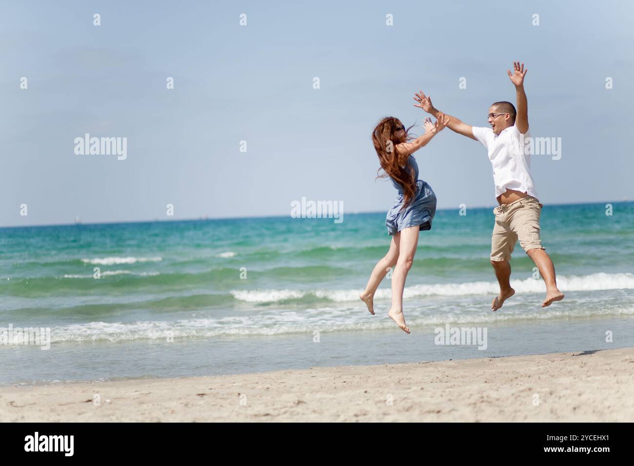 Young couple having fun beach hi-res stock photography and images - Alamy