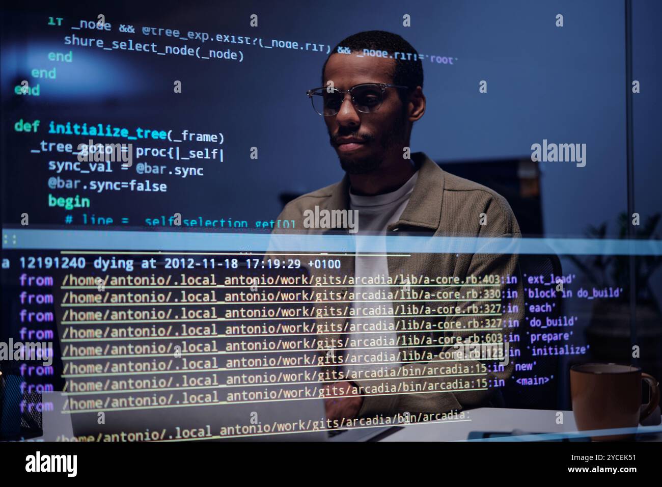 Analyzing Code on Computer Screen in Dark Office Stock Photo - Alamy