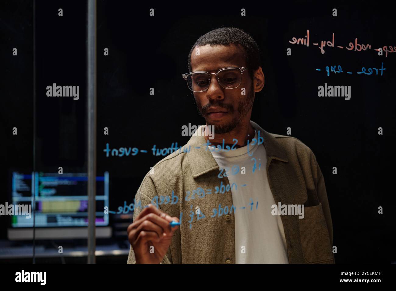 Analyzing Data on Transparent Glass Screen Stock Photo