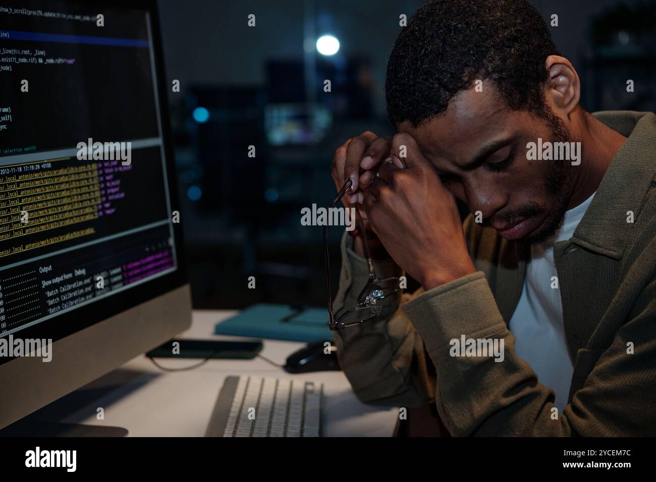 Working at Night with Computer in Office Environment Stock Photo