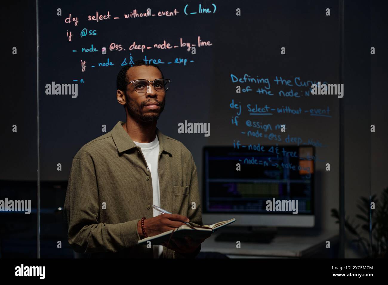 Studying Computer Code Reflected on Glass Surface Stock Photo