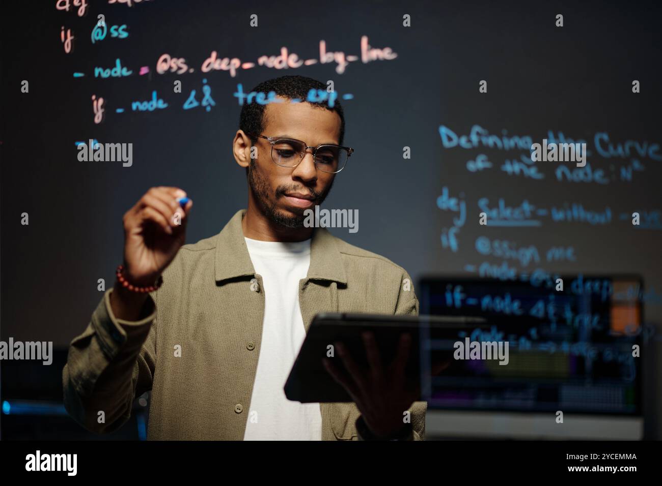 Analyzing Code on Tablet for Software Development Stock Photo